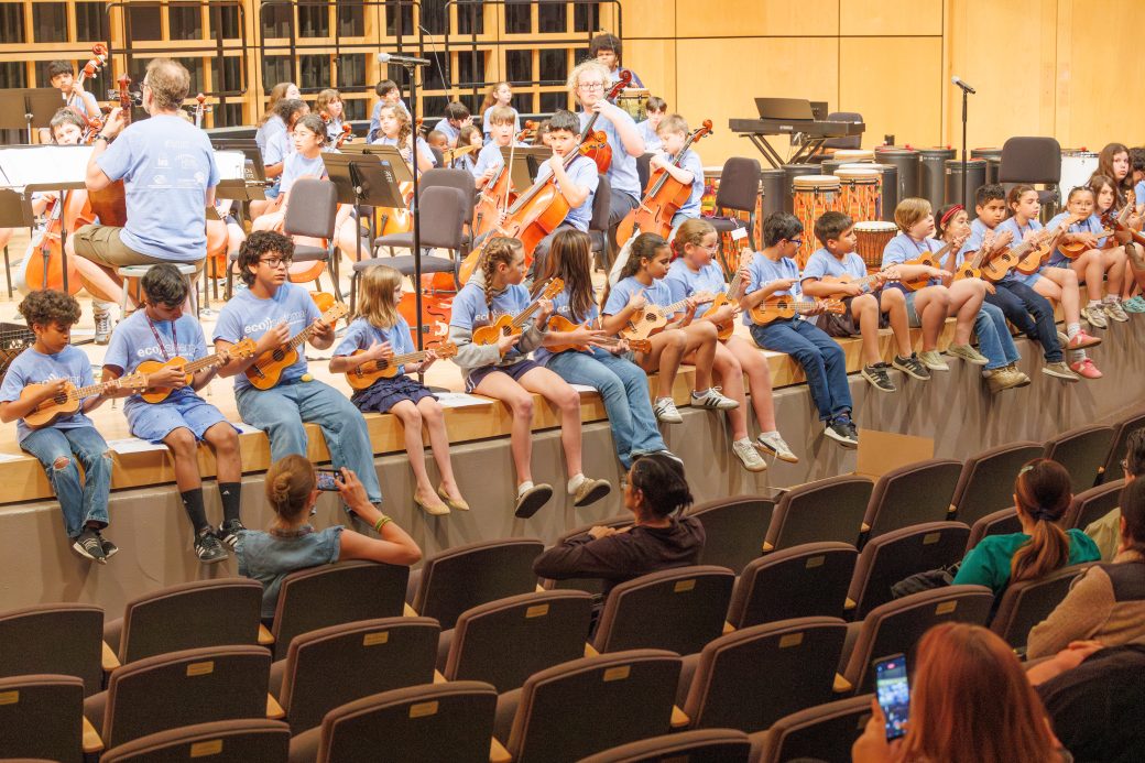 Full group of students playing ukele