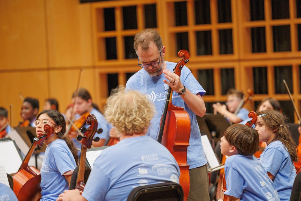 Teahcer showing student cello
