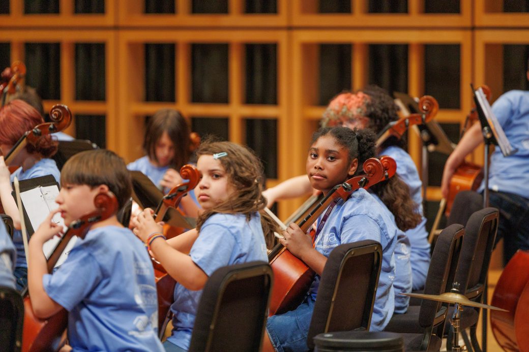 students playing instruments in performance