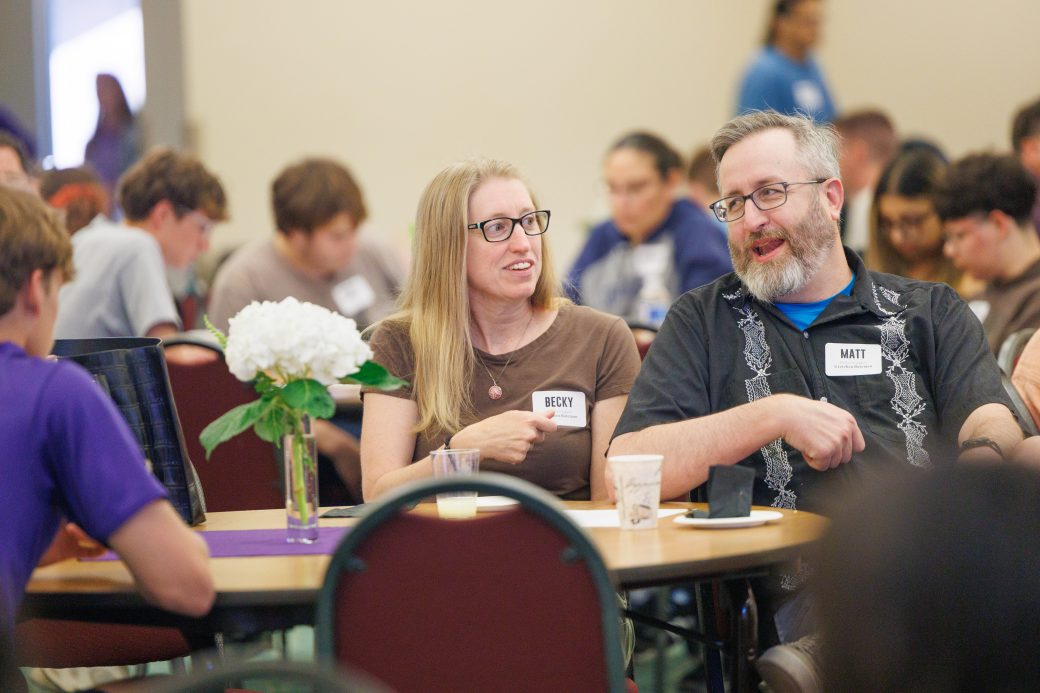 Parents talking at new student orientation