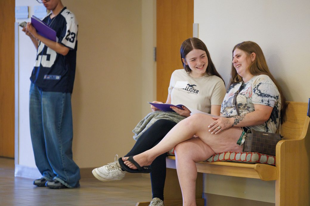 Student and mom laughing at new student orientation