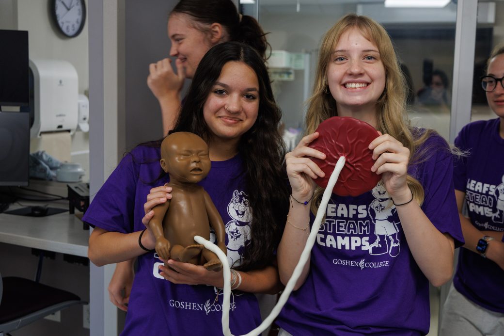 Nursing summer campers holding baby mannequin and placenta