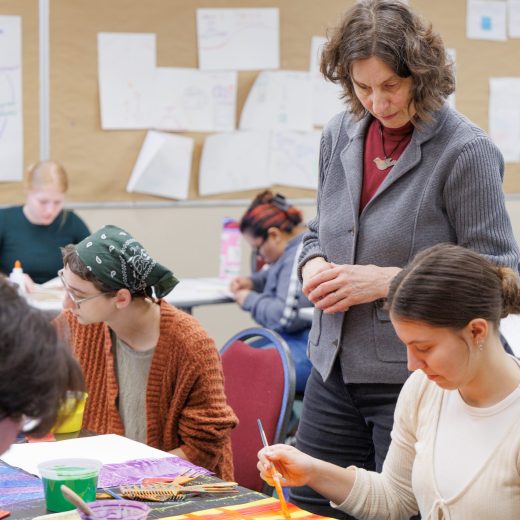 Kathy Meyer Reimer aiding her students through an in-class activity.