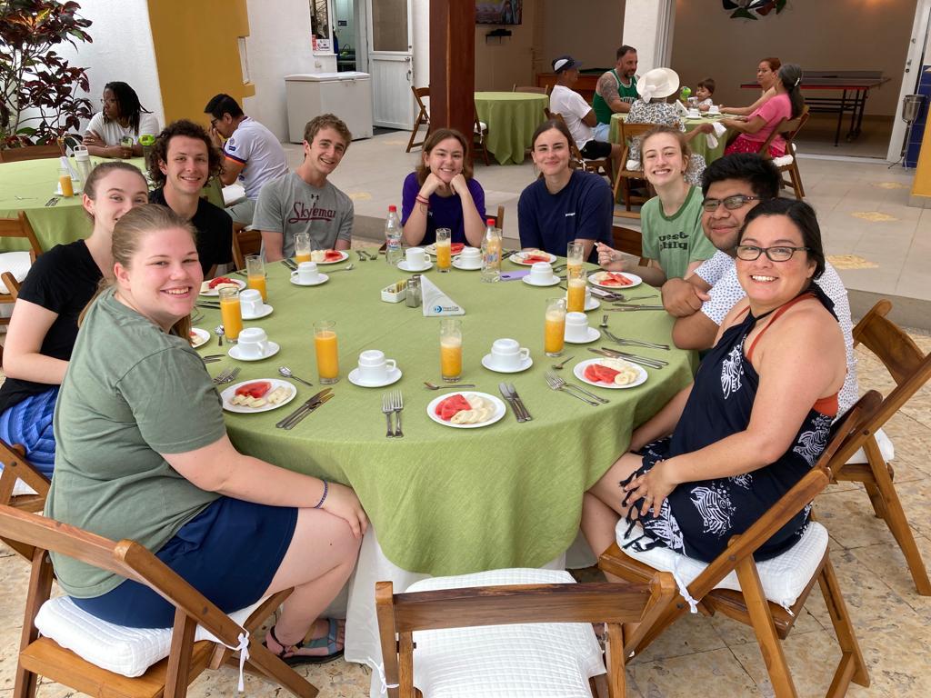 A group of students dining together at a round table.